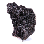 A large, impressive mineral specimen featuring a dense coverage of shiny, dark reddish-brown to black descloizite crystals in distinctive spearhead formations. The crystals, which show amber translucency, are arranged in a complex, overlapping pattern across the entire surface of the specimen. The piece is roughly triangular in shape when viewed from above, with the crystals forming dramatic, three-dimensional projections that create a textured, sculptural appearance.