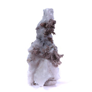 A superb specimen featuring sculptural white calcite growth decorated with crystalline silver in delicate leaf-like formations creating striking natural contrast. The 12 cm piece from Morocco's Imiter Mine displays dramatic vertical orientation, exceptional aesthetics, and exhibits vivid red fluorescence under UV light.