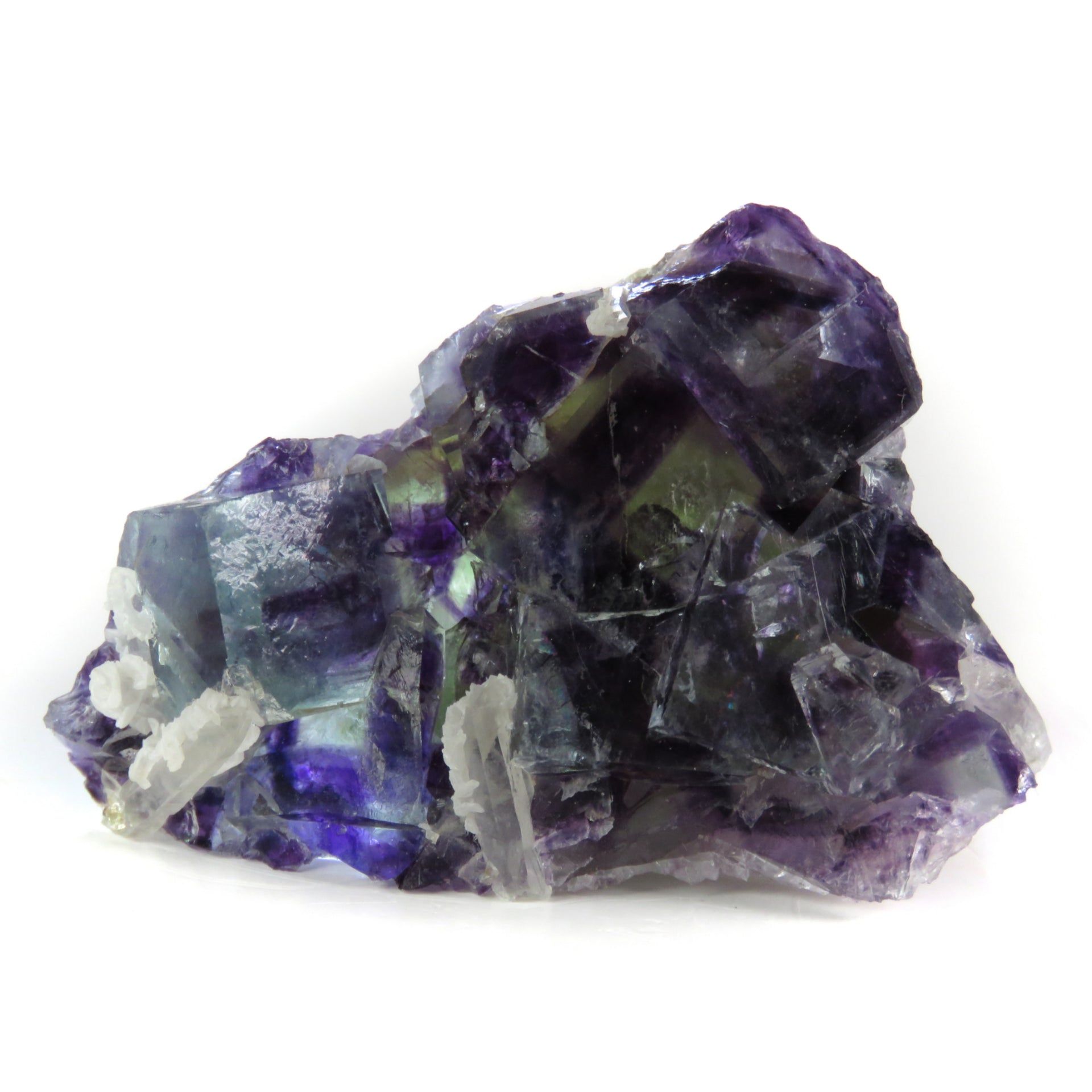 A superior fluorite specimen featuring intergrown cubic crystals with dramatic color zoning from deep purple to vivid blue when backlit. The 4 cm plate displays exceptional transparency, distinctive blue-zoned cube placement, and shows the characteristic fine crystal formation of this notable locality.