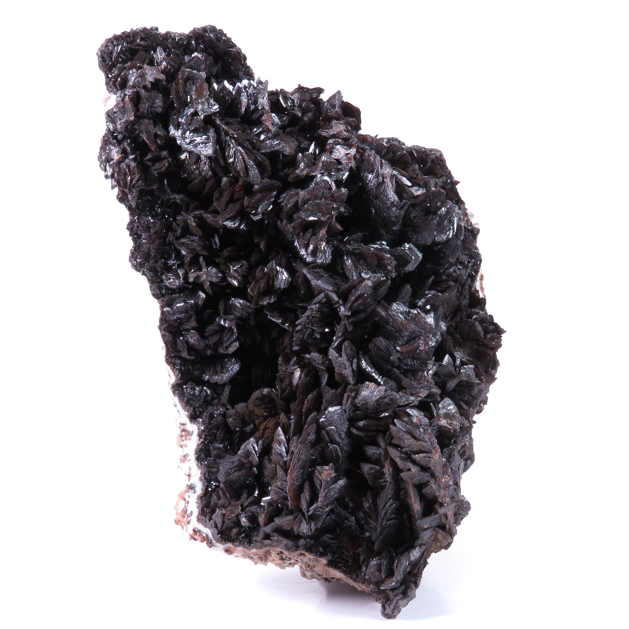 A large, impressive mineral specimen featuring a dense coverage of shiny, dark reddish-brown to black descloizite crystals in distinctive spearhead formations. The crystals, which show amber translucency, are arranged in a complex, overlapping pattern across the entire surface of the specimen. The piece is roughly triangular in shape when viewed from above, with the crystals forming dramatic, three-dimensional projections that create a textured, sculptural appearance.