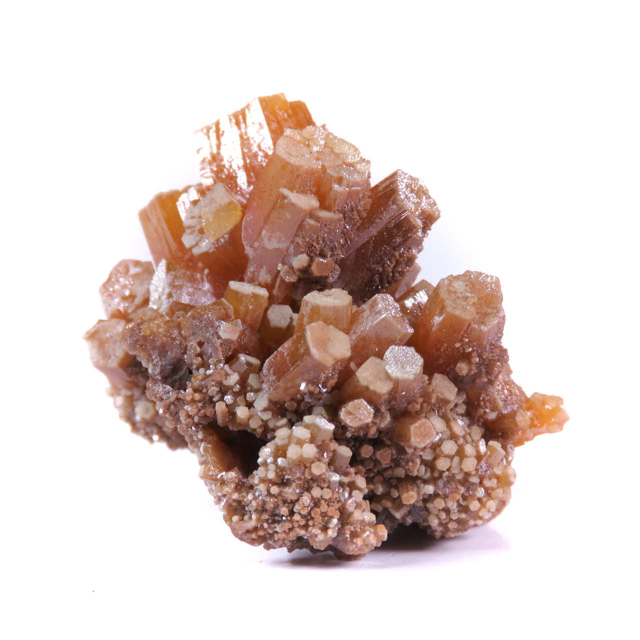 A superior Bunker Hill pyromorphite featuring sculptural barrel-shaped crystals with distinctive cream-colored terminations and a dominant orange central crystal. The 6 cm specimen from this legendary Idaho locality displays exceptional epimorphic growth patterns, pristine preservation, and represents a unique example from this world-famous mining district.