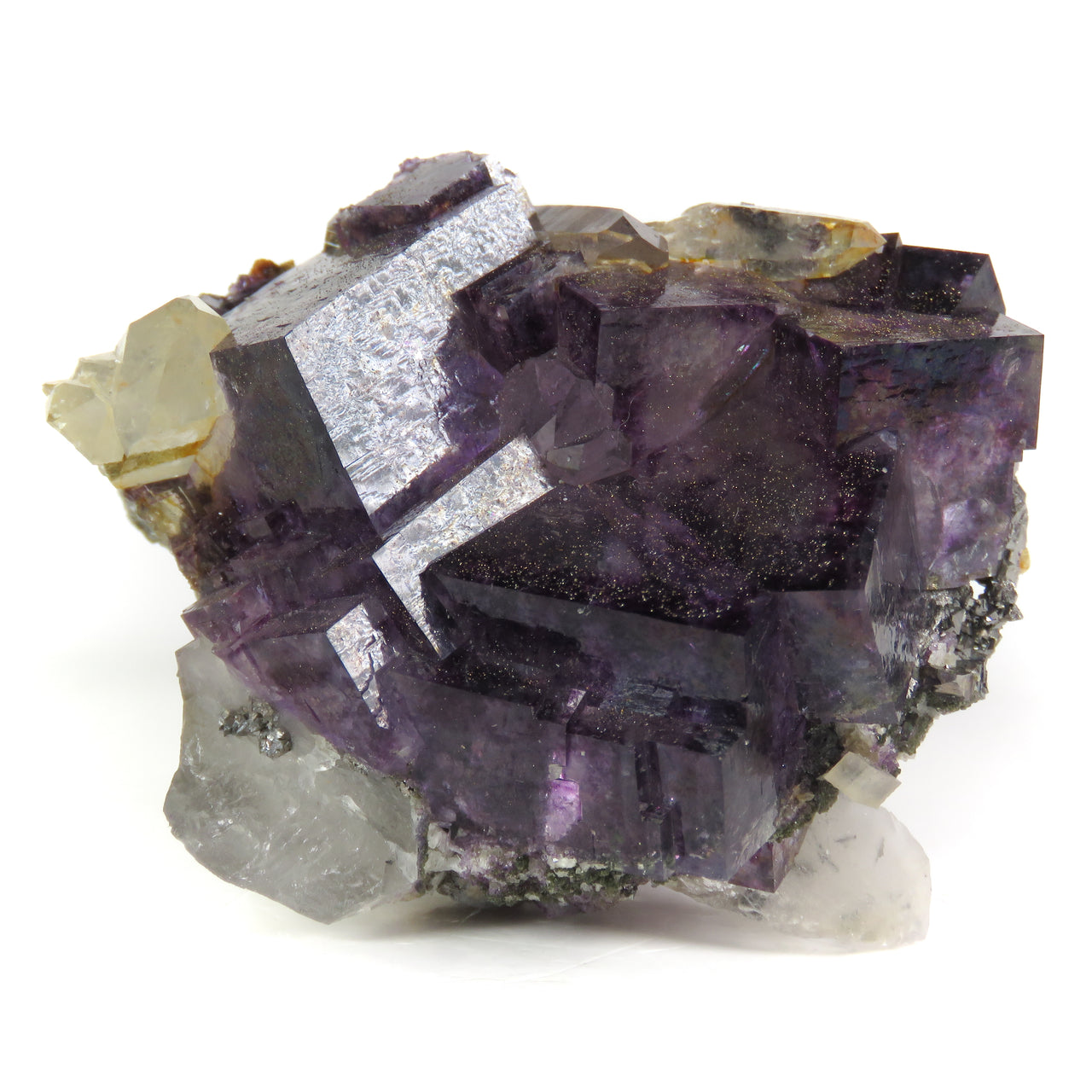 A superior fluorite specimen featuring partially twinned cubic crystals with vibrant purple transparency and distinctive arsenopyrite and chalcopyrite accents. The 5 cm cluster displays iridescent crystal faces, sparkles in strong lighting, and sits elegantly perched on white quartz matrix.