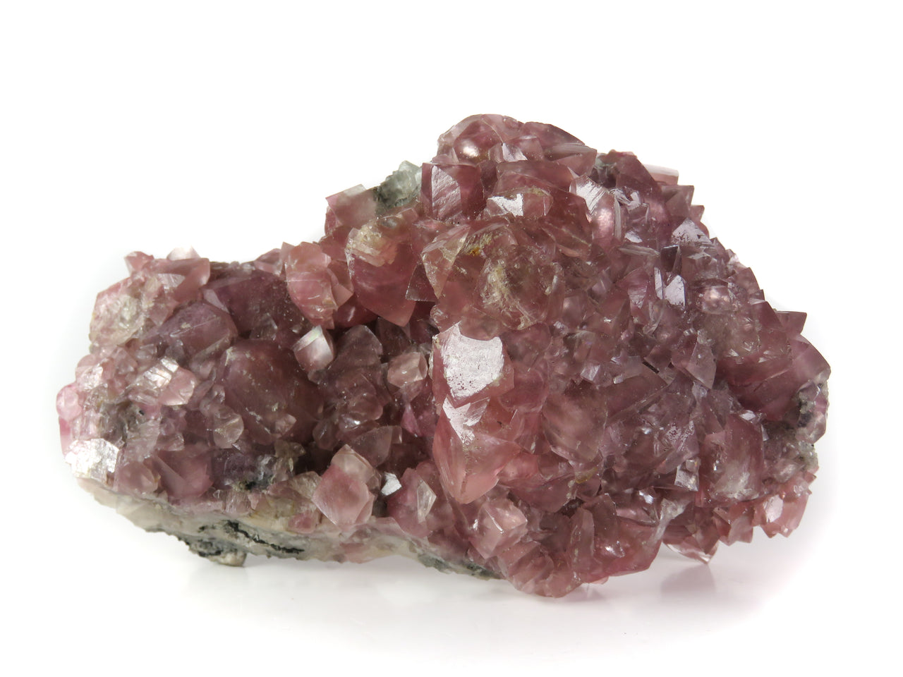 A magnificent pink smithsonite specimen featuring robust rhombohedral crystals with delicate rosy coloration derived from a complex mix of metallic chromophores. The 10 cm piece from Namibia's renowned Tsumeb Mine displays exceptional crystal development, classic curved faces, and represents a superior example from this historic locality's golden age.