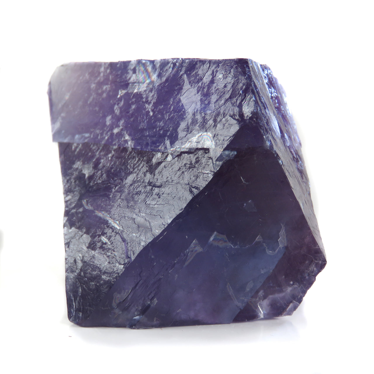 A pristine matrix-free fluorite octahedron from San Lino, Spain, displaying striking blue to violet color zoning. This 3 cm crystal exemplifies the high quality specimens from this locality near Berbes, with exceptional transparency that creates dramatic effects when backlit.