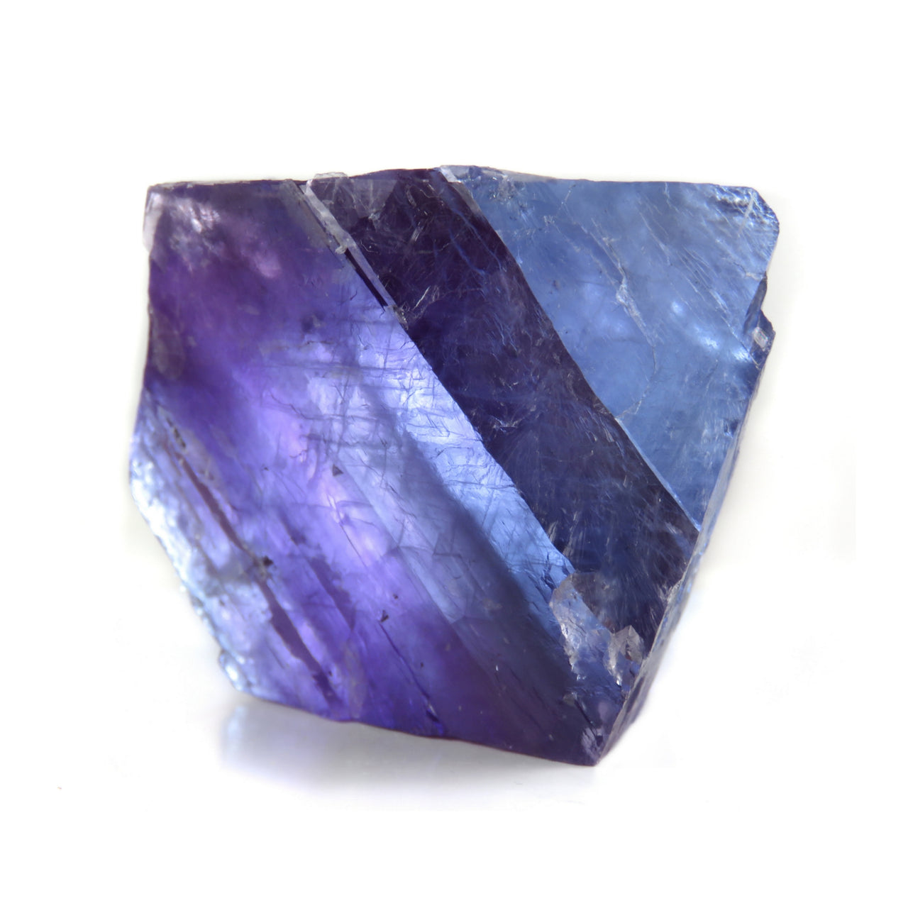 A pristine matrix-free fluorite octahedron from San Lino, Spain, displaying striking blue to violet color zoning. This 3 cm crystal exemplifies the high quality specimens from this locality near Berbes, with exceptional transparency that creates dramatic effects when backlit.