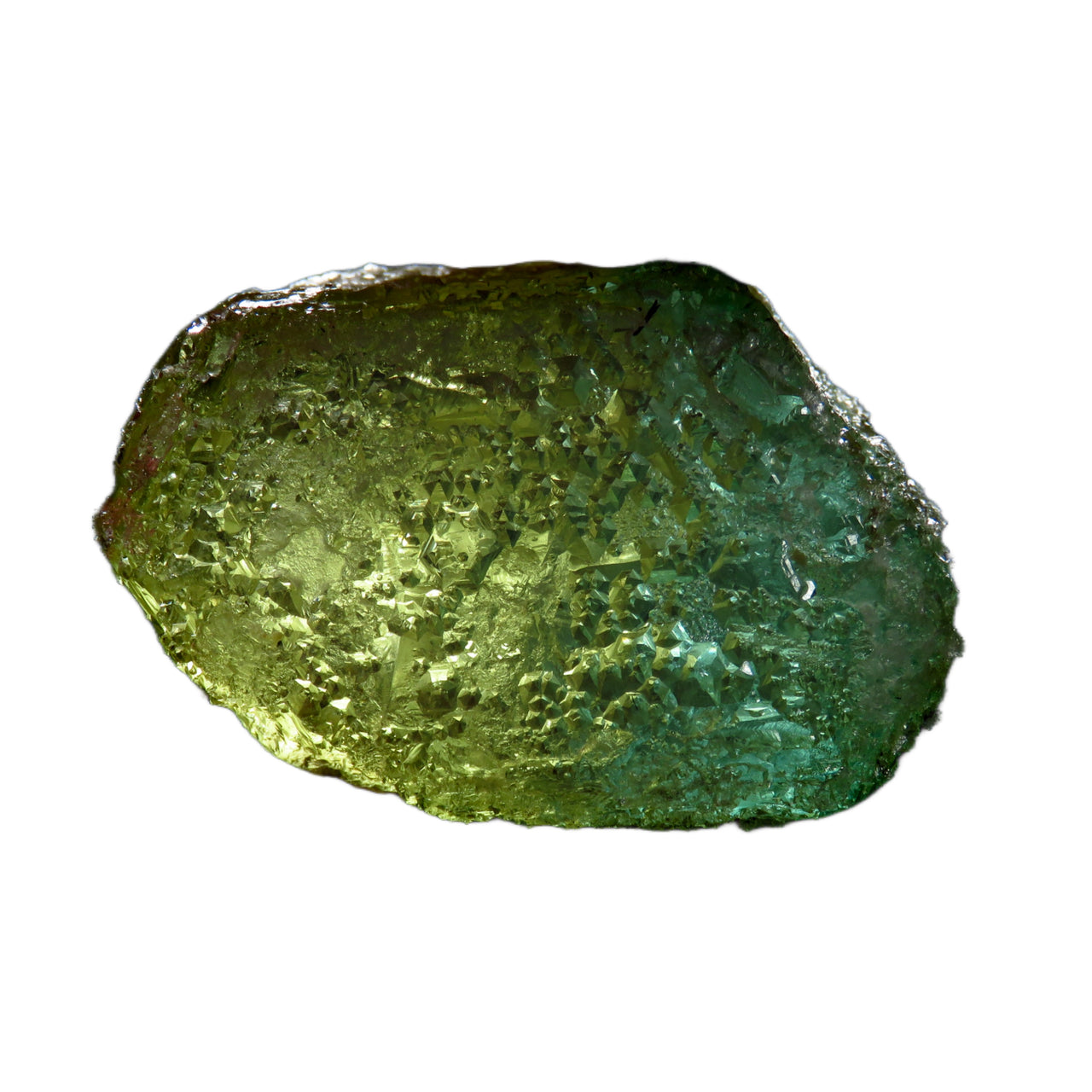 A large etched crystal of bi-color beryl showing a dramatic transition from golden yellow heliodor to blue-green aquamarine. The naturally etched surface creates a mesmerizing pattern of hexagonal pyramids, giving the 566-carat specimen a sculptural quality. The crystal appears translucent and glows when backlit, emphasizing its unique color zoning.