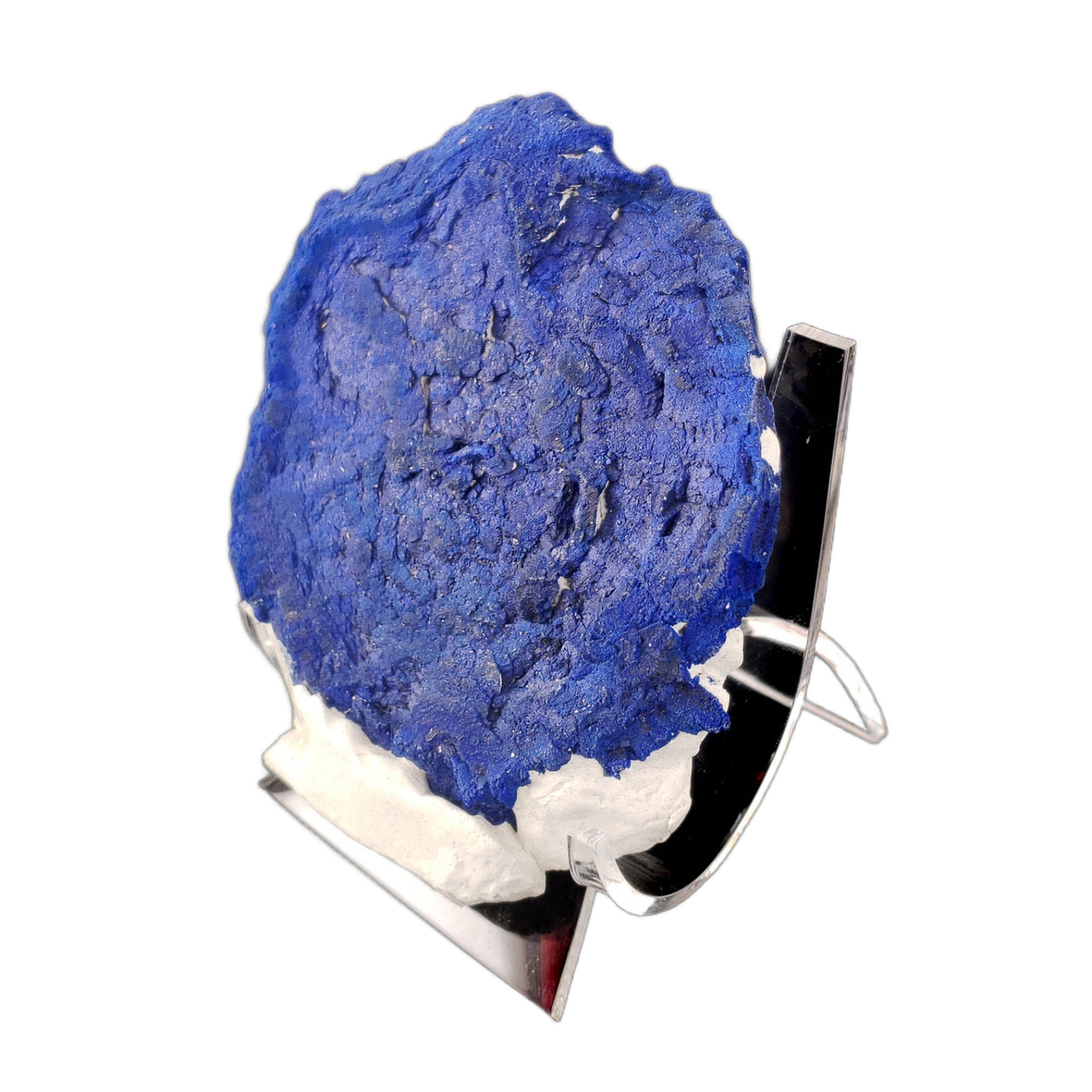 A circular 'sun-like' formation of deep blue azurite crystals. The specimen forms a nearly perfect disc shape with a rich, royal blue coloration and subtle surface texture. The edges show a thin rim of white kaolinite matrix. The azurite formation demonstrates the distinctive 'sunburst' pattern characteristic of these rare specimens.