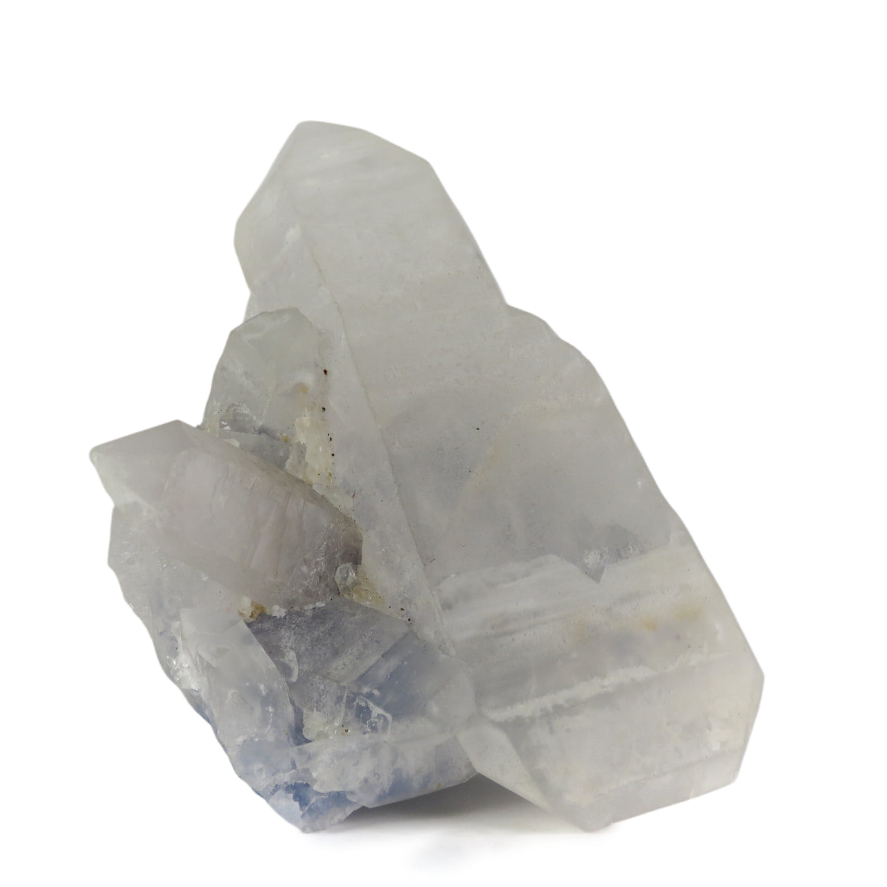 A prominent milky white quartz crystal with mixed prismatic and tabular terminations, emerging from a deep blue dumortierite-rich matrix. Smaller quartz crystals line the left side, creating a balanced composition between the lustrous white crystals and the deep blue background matrix from Brazil's Vaca Morta Quarry.